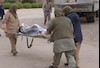 مجاهدان اشرف در حین انتقال یکی از مجروحان خواهر در حماسه فروغ اشرف