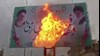 آتش زدن بنر خامنه‌ای و خمینی در کرمانشاه 