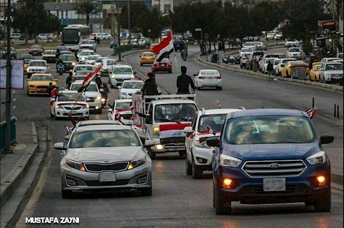 کربلا - تظاهرات با خودروها و به‌دست گرفتن پرچمهای عراق 