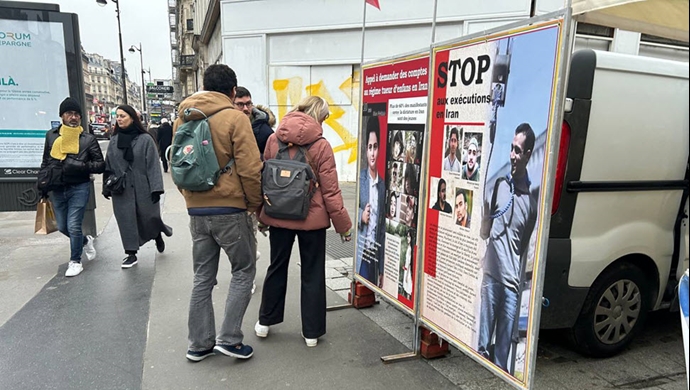 پاریس - برگزاری میز کتاب همراه با نمایش تصاویر شهیدان در همبستگی با قیام سراسری - ۲۲دی