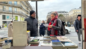 پاریس - برگزاری میز کتاب و نمایش تصاویر شهیدان در همبستگی با قیام سراسری - ۱۷بهمن