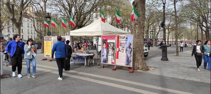 پاریس - برگزاری میز کتاب و نمایش تصاویر شهیدان در همبستگی با قیام سراسری - ۱۸فروردین