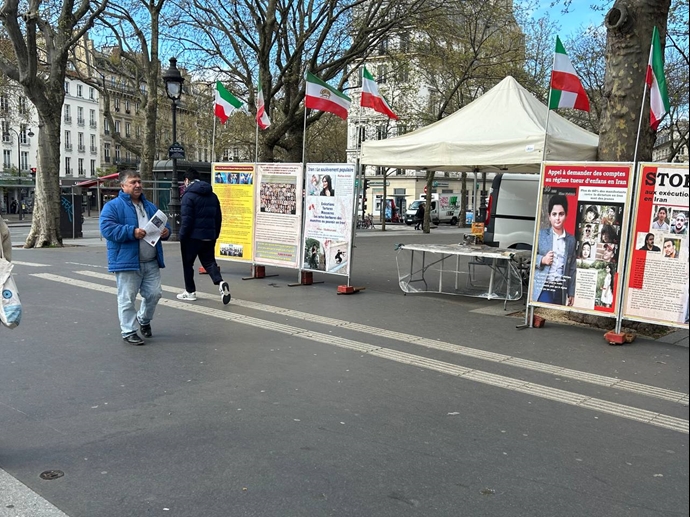 پاریس - برگزاری میز کتاب و نمایش تصاویر شهیدان توسط ایرانیان آزاده در همبستگی با قیام سراسری - ۱۵فروردین