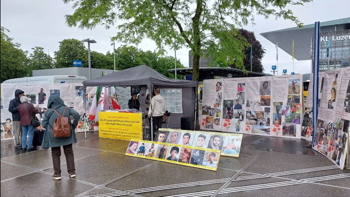 لوتزرن سوئیس - برگزاری میز کتاب و نمایش تصاویر شهیدان در همبستگی با قیام سراسری - ۴خرداد