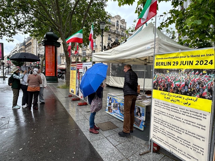 پاریس - برگزاری میز کتاب و نمایش تصاویر شهیدان در همبستگی با قیام سراسری توسط ایرانیان آزاده - ۱۰خرداد