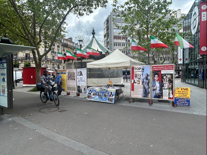 پاریس - برگزاری میز کتاب و نمایش تصاویر شهیدان در همبستگی با قیام سراسری توسط ایرانیان آزاده - ۱۸اردیبهشت