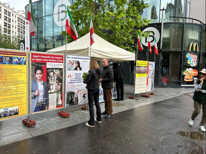پاریس - برگزاری میز کتاب و نمایش تصاویر شهیدان در همبستگی با قیام سراسری توسط ایرانیان آزاده - ۱۰خرداد