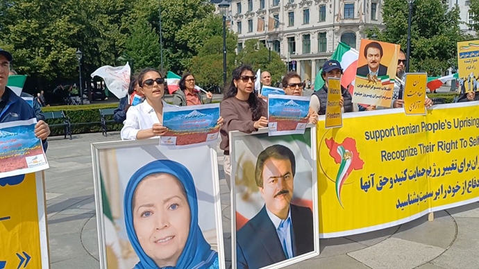 اسلو - برگزاری میز کتاب و نمایش تصاویر شهیدان در آستانه برگزاری تظاهرات بزرگ ایرانیان آزاده در برلین - ۲۶خرداد
