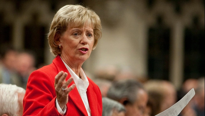 جودی اسگرو رئیس کمیتهٔ تجارت بین‌المللی پارلمان کانادا و وزیر پیشین مهاجرت
