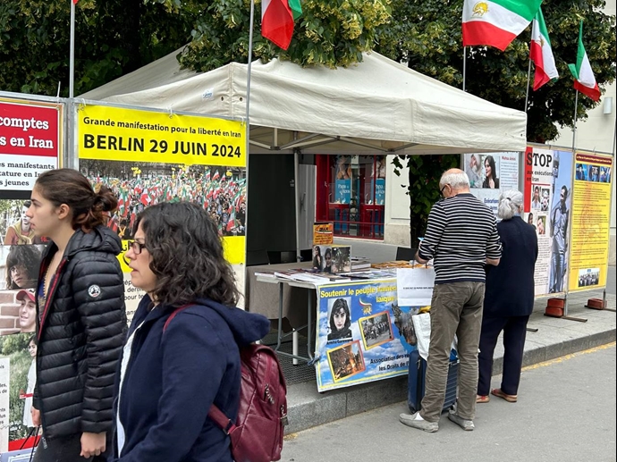 پاریس - برگزاری میز کتاب و نمایش تصاویر شهیدان قیام در همبستگی با قیام سراسری توسط ایرانیان آزاده - ۲۳خرداد