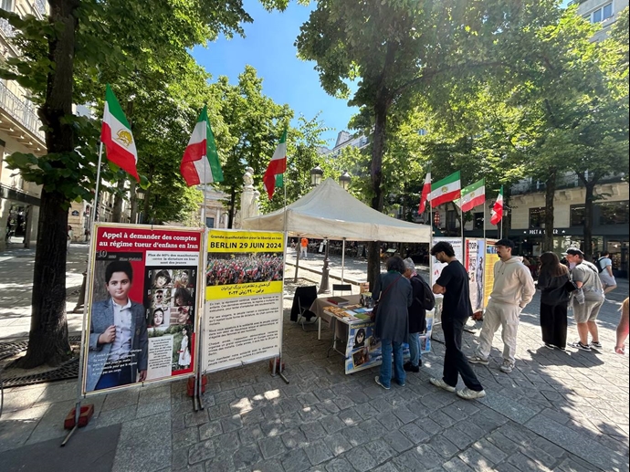 پاریس - برگزاری میز کتاب و نمایش تصاویر شهیدان در همبستگی با قیام سراسری توسط ایرانیان آزاده - ۱۸خرداد