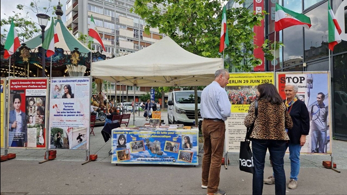 پاریس - برگزاری میز کتاب و نمایش تصاویر شهیدان در همبستگی با قیام سراسری توسط ایرانیان آزاده - ۱۵خرداد