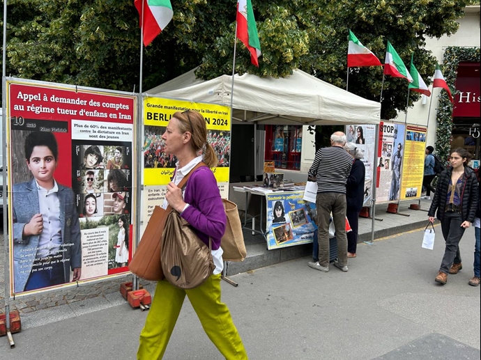 پاریس - برگزاری میز کتاب و نمایش تصاویر شهیدان قیام در همبستگی با قیام سراسری توسط ایرانیان آزاده - ۲۳خرداد