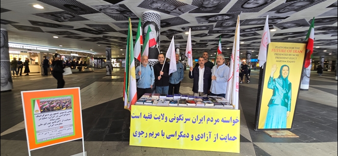 استکهلم - برگزاری میز کتاب و نمایش تصاویر شهیدان قیام در همبستگی با قیام سراسری توسط ایرانیان آزاده - ۲۲خرداد