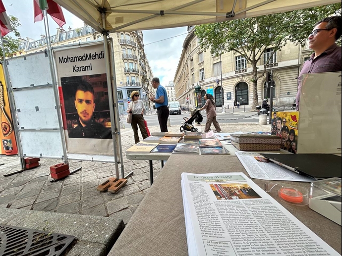 پاریس - برگزاری میز کتاب و نمایش تصاویر شهیدان در همبستگی با قیام سراسری - ۲مرداد ۱۴۰۳