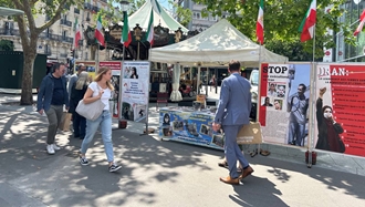 پاریس - برگزاری میز کتاب و نمایش تصاویر شهیدان در همبستگی با قیام سراسری توسط ایرانیان آزاده - ۲۸تیرماه