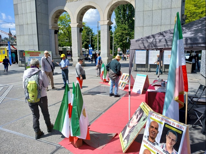 لوتزرن سوئیس - برگزاری میز کتاب و نمایش تصاویر شهیدان در همبستگی با قیام سراسری - ۲۶اردیبهشت