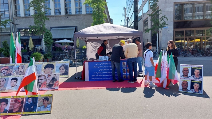 زوریخ سوئیس - برگزاری میز کتاب و نمایش تصاویر شهیدان در اعتراض به صدور احکام اعدام علیه زندانیان سیاسی - ۲۰اردیبهشت