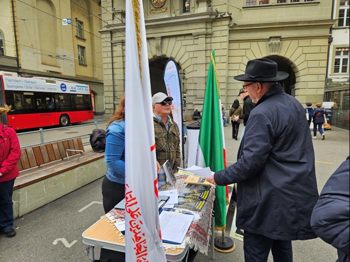 برن - سوئیس، برگزاری میز کتاب و نمایش تصاویر شهیدان علیه صدور احکام اعدام توسط قضاییه خامنه‌ای