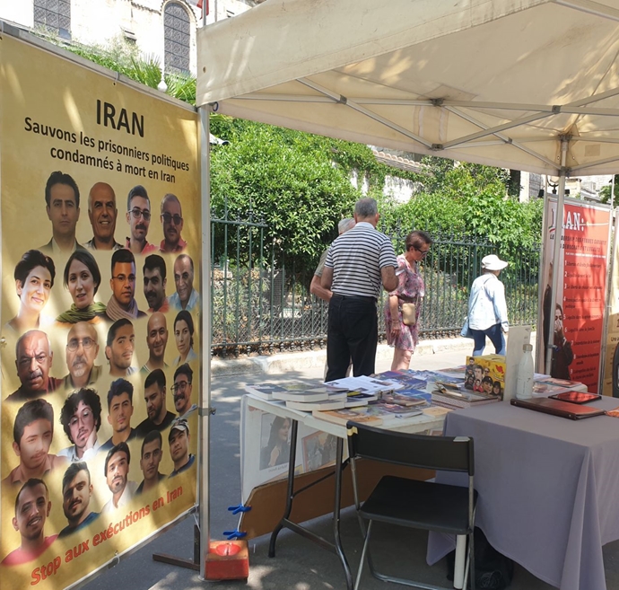 پاریس - میز کتاب و نمایشگاه عکس شهیدان در حمایت از قیام سراسری مردم ایران - ۲۳خرداد ۱۴۰۴