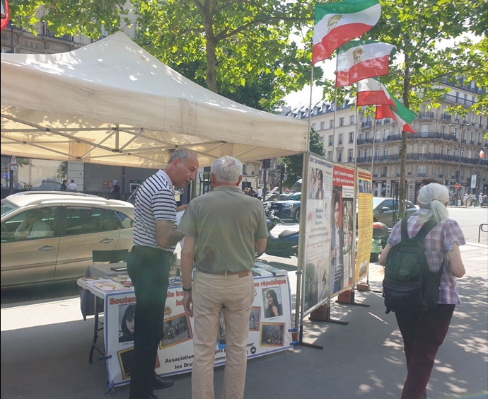پاریس - میز کتاب و نمایشگاه عکس شهیدان در حمایت از قیام سراسری مردم ایران - ۲۳خرداد ۱۴۰۴