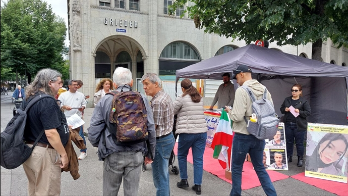 برن سوئیس - برگزاری میز کتاب و نمایش تصاویر شهیدان در همبستگی با زندانیان سیاسی - ۱۶خرداد