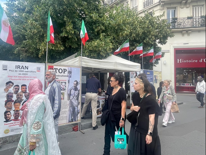 پاریس - برگزاری میز کتاب و نمایش تصاویر شهیدان در حمایت از زندانیان سیاسی - ۳۱ تیر ۱۴۰۴
