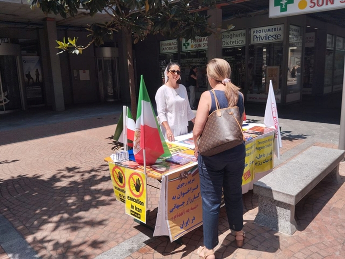 لوگانو سوئیس - برگزاری میز کتاب و نمایش تصاویر شهیدان در همبستگی با قیام سراسری - ۲۱تیرماه