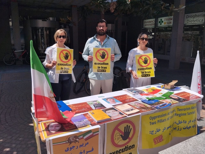 لوگانو سوئیس - برگزاری میز کتاب و نمایش تصاویر شهیدان در همبستگی با قیام سراسری - ۲۱تیرماه