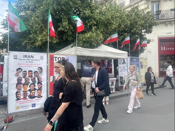 پاریس - برگزاری میز کتاب و نمایش تصاویر شهیدان در حمایت از زندانیان سیاسی - ۳۱ تیر ۱۴۰۴