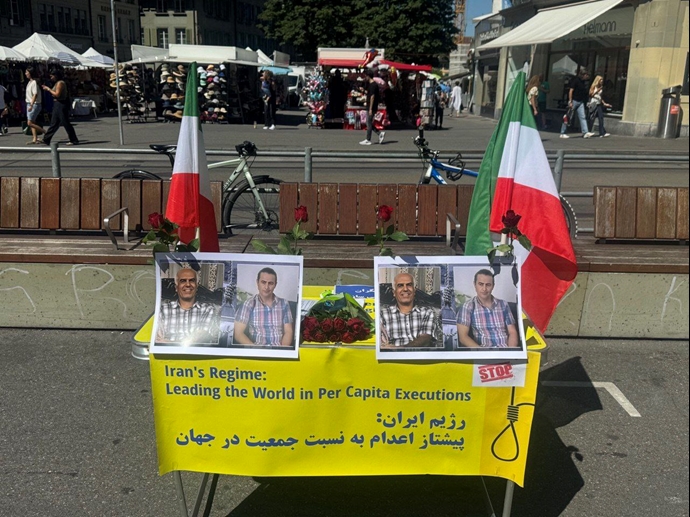 برن سوئیس - برگزاری میز کتاب با یاد دو شهید قهرمان مهدی حسنی و بهروز احسانی و محکومیت احکام ضدانسانی اعدام - ۱۷مرداد