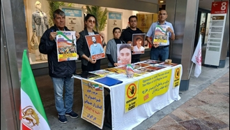 لوکانو سوئیس - برگزاری میز کتاب در همبستگی با زندانیان سیاسی و دعوت به شرکت در تظاهرات بزرگ در پاریس